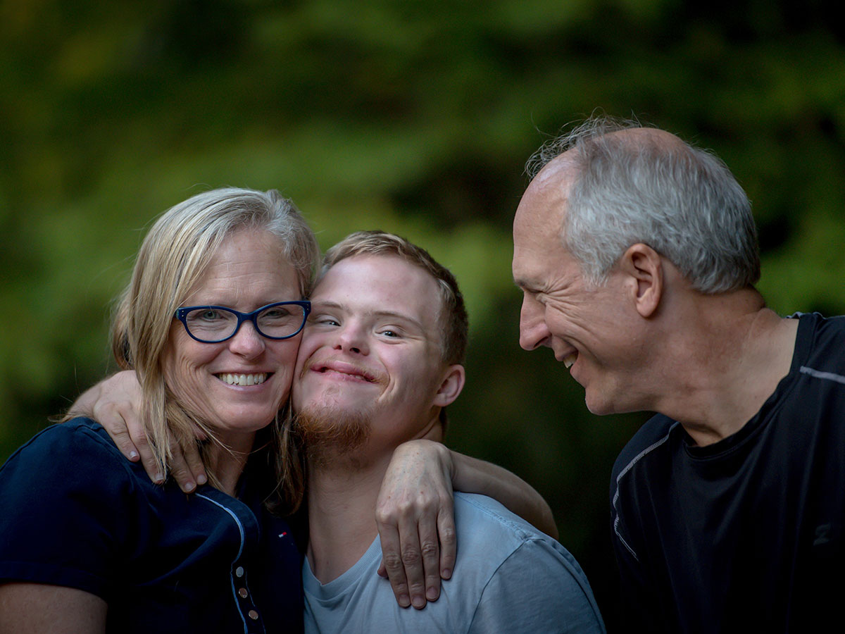 Young man with happy family