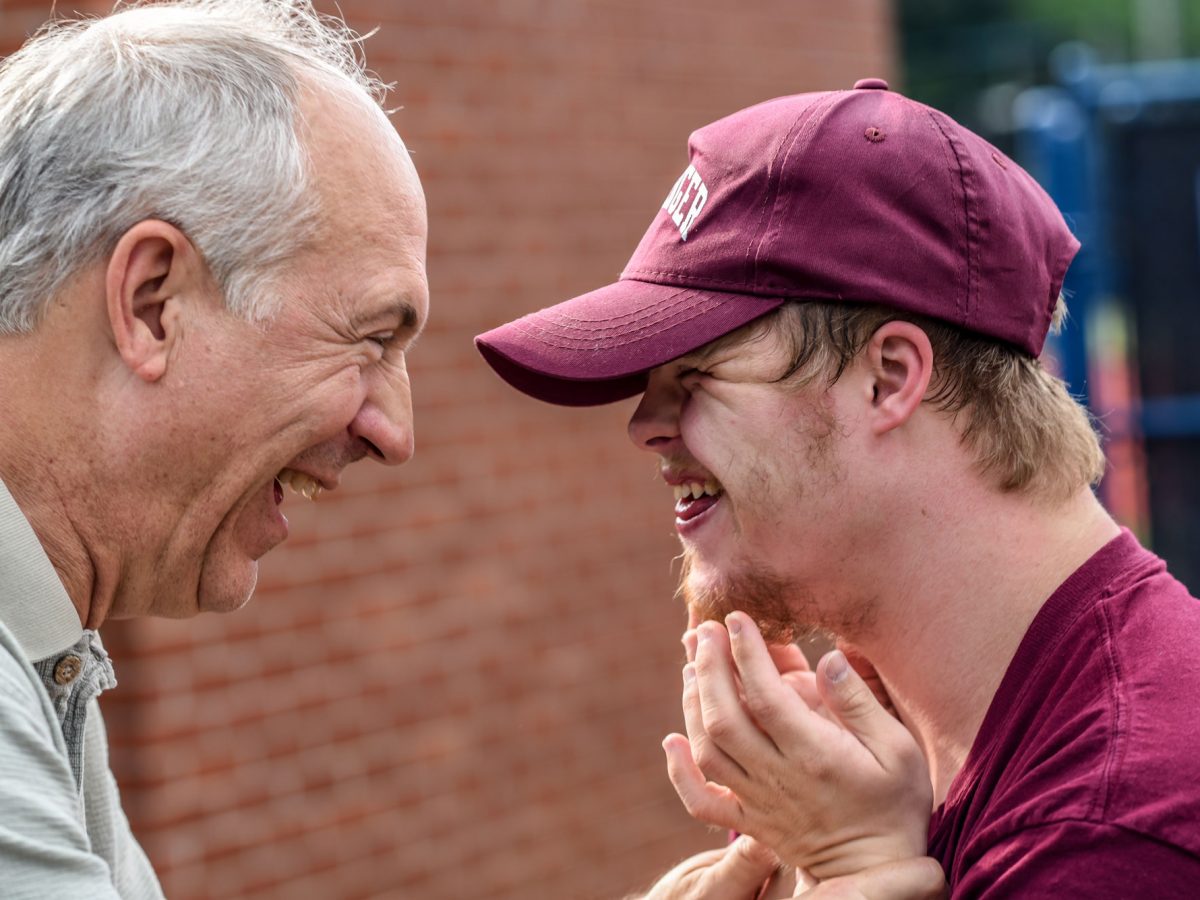 Man laughing with grandfather